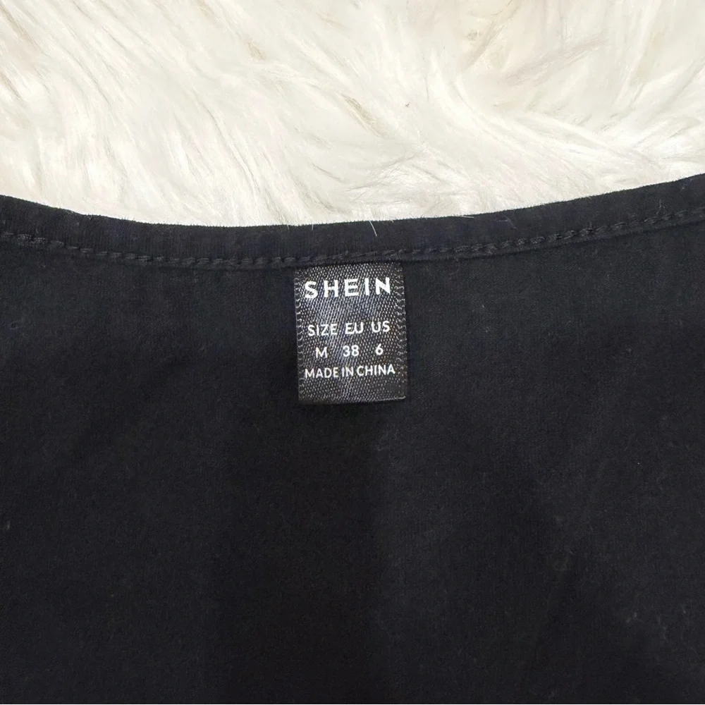 Black cropped long sleeve top